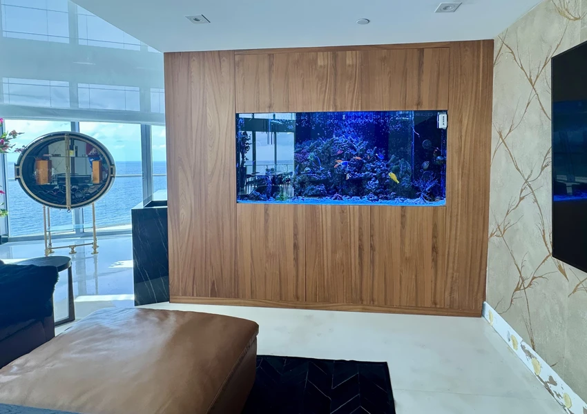 Divider aquarium in custom wooden furniture separating house zones