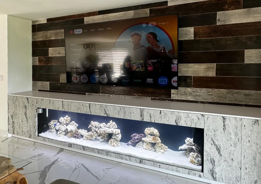 Floor-level custom aquarium against wall
