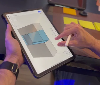 Person designing a custom aquarium on a tablet