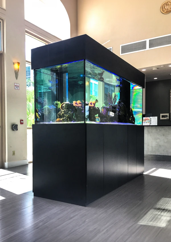 Freestanding island aquarium in the middle of a hotel lobby.