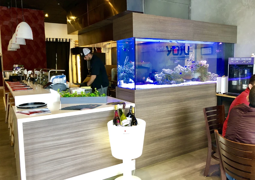 Aquarium installation enhancing the dining experience in a restaurant.